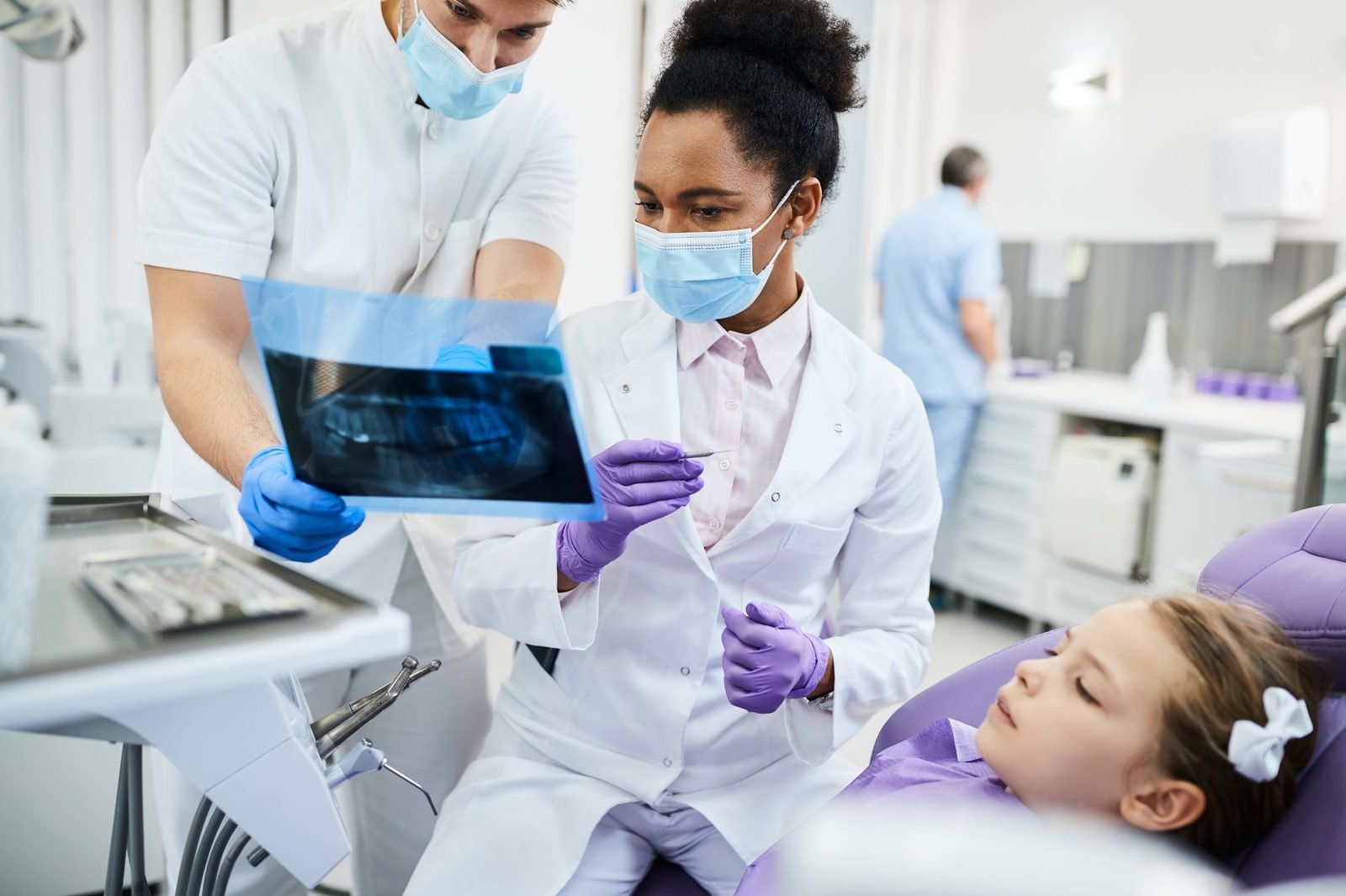 Dental clinic team reviewing an x-ray together