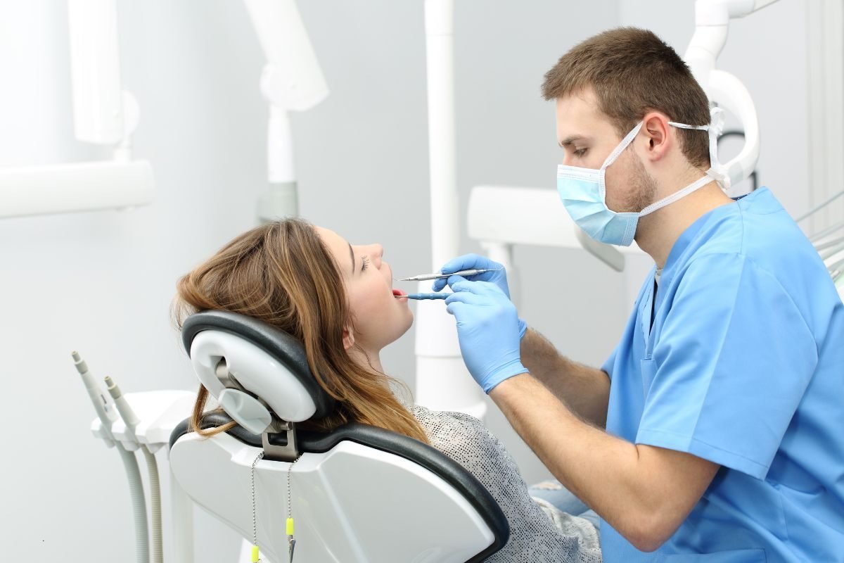 Dentist treating a patient during an urgent visit