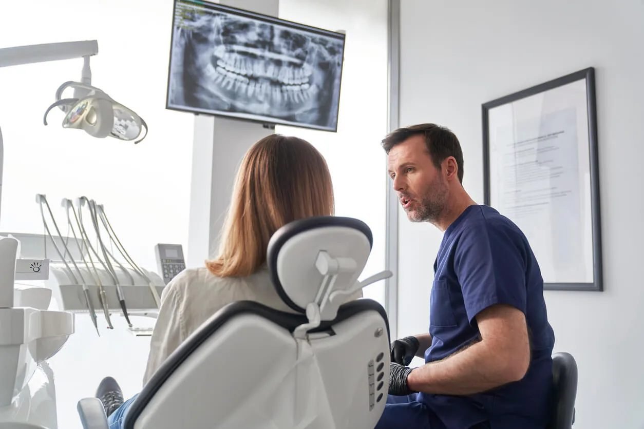 Dentist explaining findings to a patient